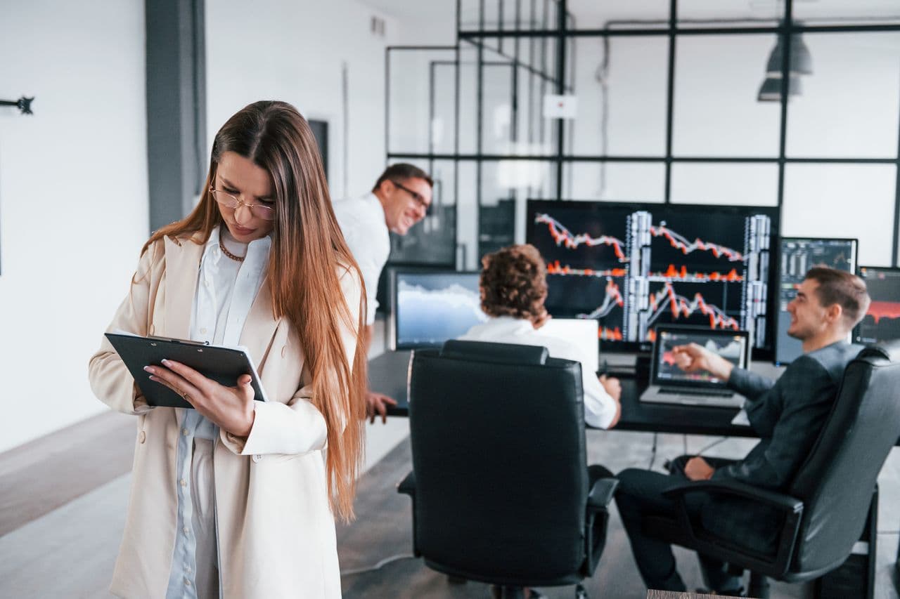 Analysts reviewing market data on trading screens