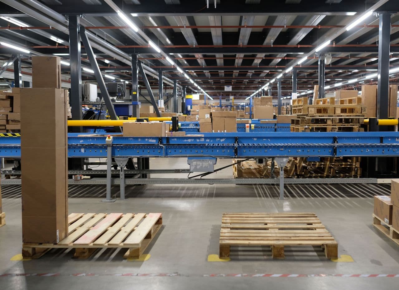 High-bay racking and conveyor lines in a warehouse