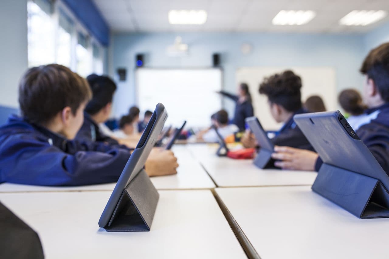 Students working on tablets in a classroom