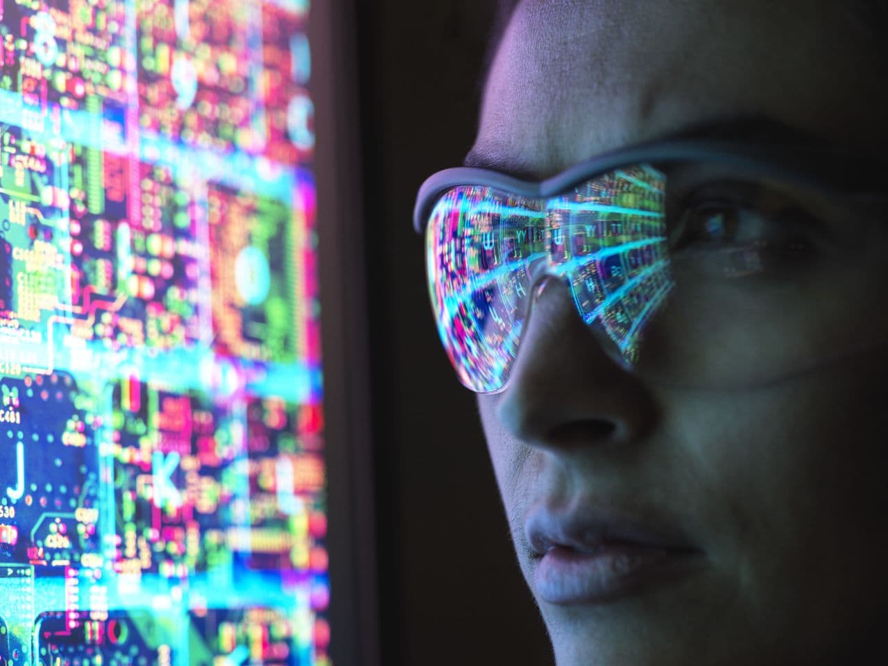 Data visualisation reflected on a person's face