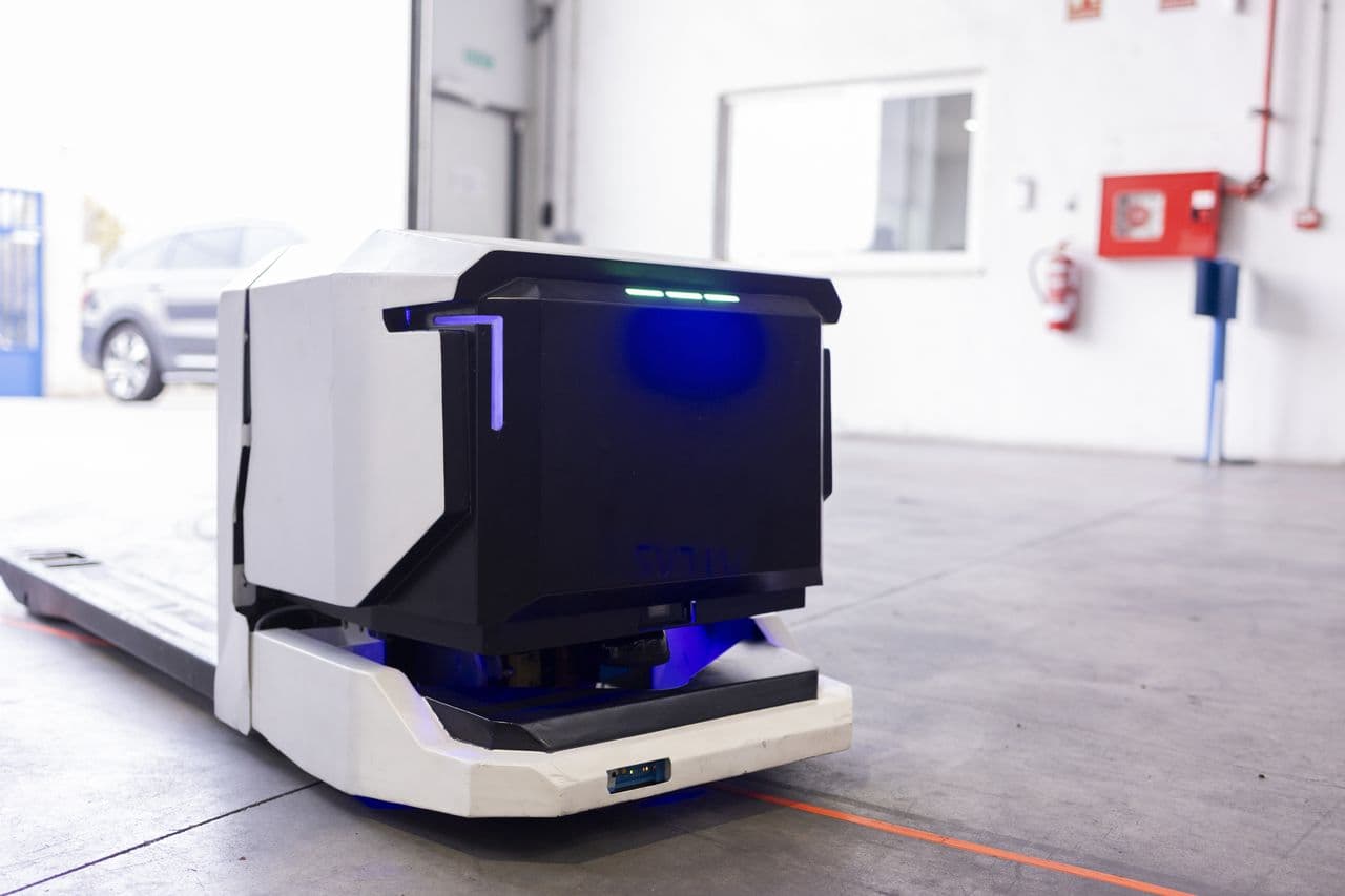 Autonomous mobile robot in a warehouse, ready for its next task